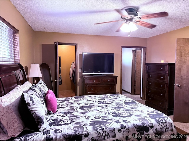 2902 Hilltop Ave, Muskogee, OK 74403 - bedroom with a textured ceiling and ceiling fan