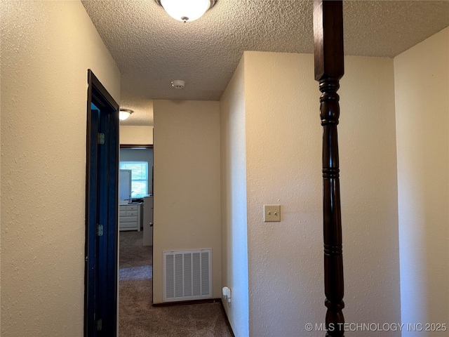 2902 Hilltop Ave, Muskogee, OK 74403 - hall featuring carpet flooring and a textured ceiling