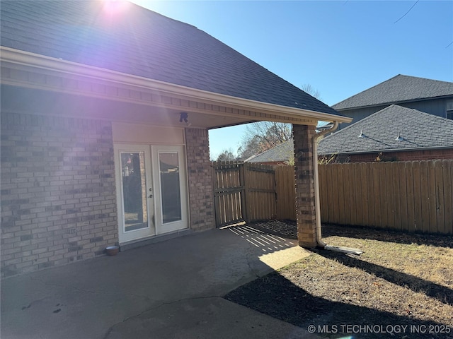 2902 Hilltop Ave, Muskogee, OK 74403 - view of patio with fence and french doors