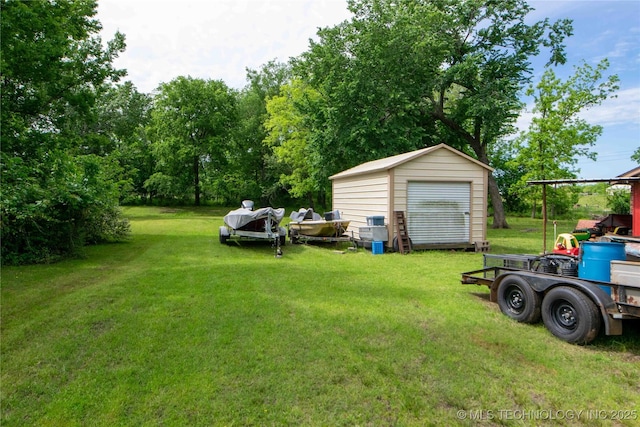 view of grassy yard with a shed and an outdoor structure