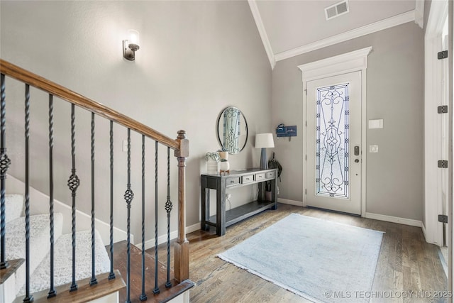 4415 S 187th E Pl, Tulsa, OK 74134 - foyer entrance featuring crown molding, lofted ceiling, stairs, wood finished floors, and baseboards