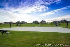 118 W 130th Pl S, Jenks, OK 74037 - view of home's community with a lawn