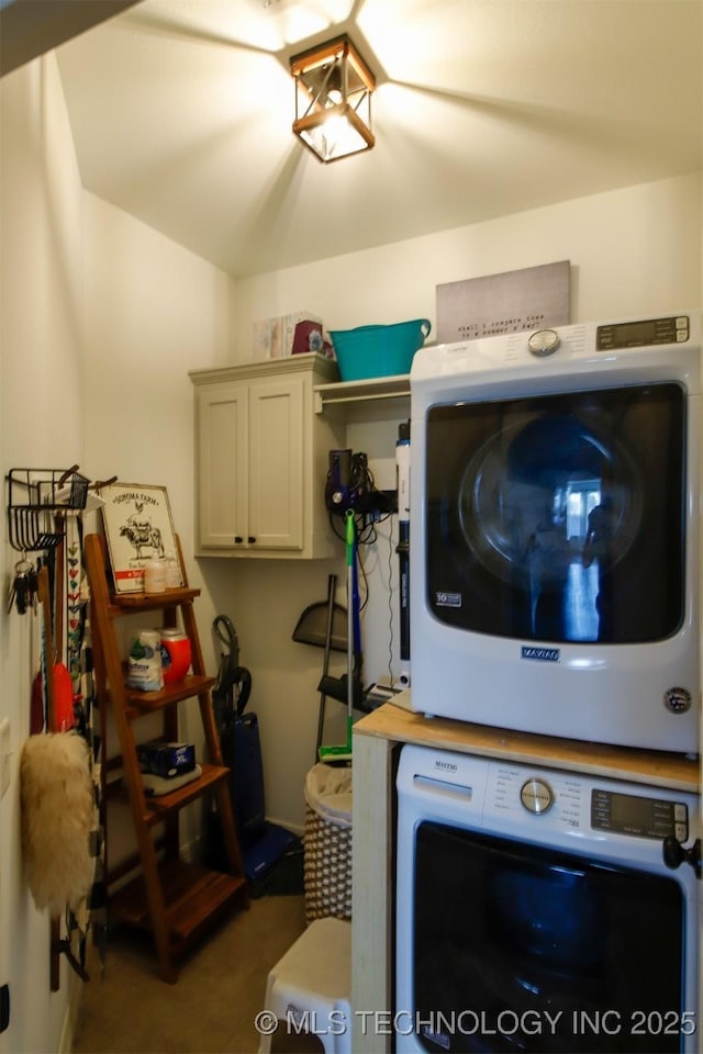 118 W 130th Pl S, Jenks, OK 74037 - washroom with stacked washer / dryer and cabinet space