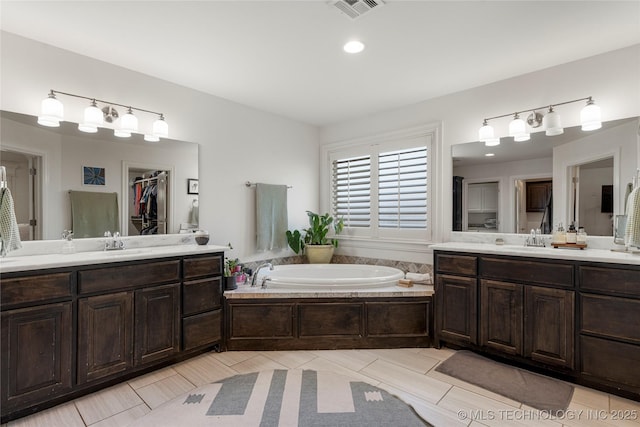2835 E 104th St, Tulsa, OK 74137 - full bath featuring two vanities, a garden tub, and a spacious closet