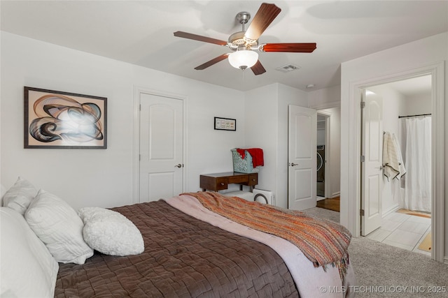 2835 E 104th St, Tulsa, OK 74137 - bedroom with washer / dryer, a ceiling fan, carpet flooring, and ensuite bathroom