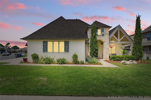 2835 E 104th St, Tulsa, OK 74137 - view of front of home with a shingled roof, a lawn, and stucco siding
