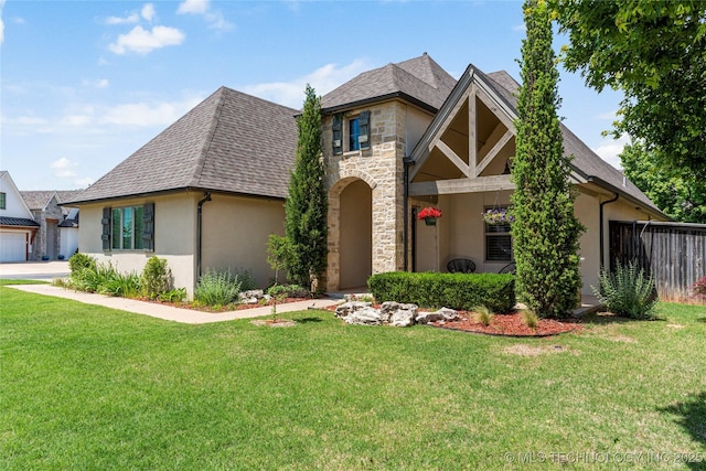 2835 E 104th St, Tulsa, OK 74137 - tudor house with stucco siding, a front yard, and stone siding