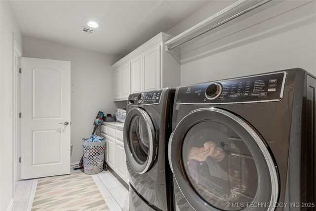 2835 E 104th St, Tulsa, OK 74137 - laundry area featuring independent washer and dryer and cabinet space