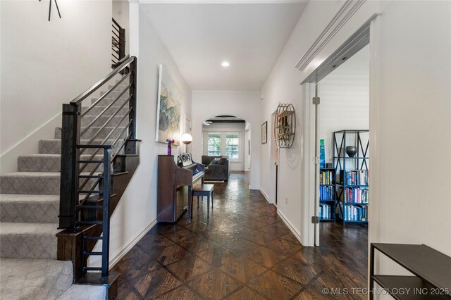 2835 E 104th St, Tulsa, OK 74137 - corridor featuring arched walkways, baseboards, stairs, and recessed lighting