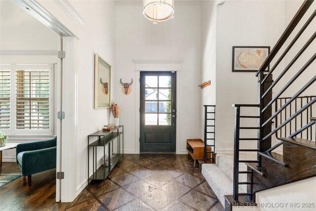 2835 E 104th St, Tulsa, OK 74137 - entryway with a towering ceiling, baseboards, stairway, and dark stone finish flooring