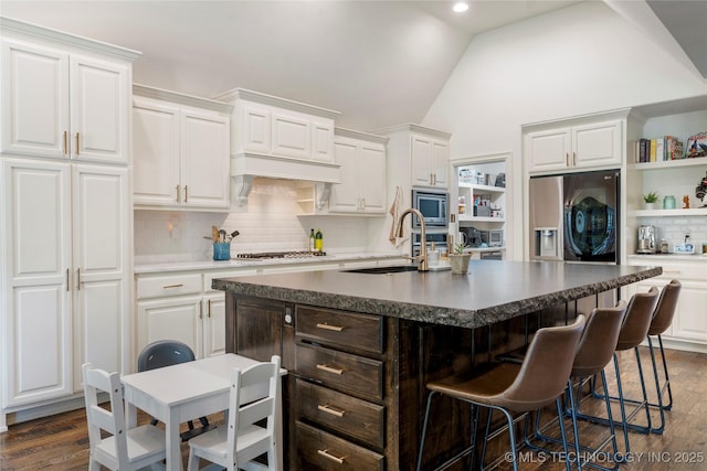 2835 E 104th St, Tulsa, OK 74137 - kitchen featuring a sink, stainless steel appliances, vaulted ceiling, white cabinetry, and open shelves