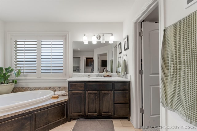 2835 E 104th St, Tulsa, OK 74137 - full bath with a garden tub, vanity, and tile patterned flooring