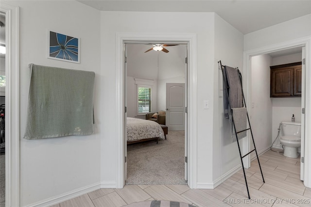 2835 E 104th St, Tulsa, OK 74137 - bathroom with toilet, a ceiling fan, baseboards, and ensuite bathroom