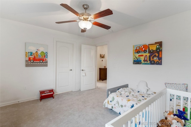 2835 E 104th St, Tulsa, OK 74137 - carpeted bedroom with ceiling fan and baseboards