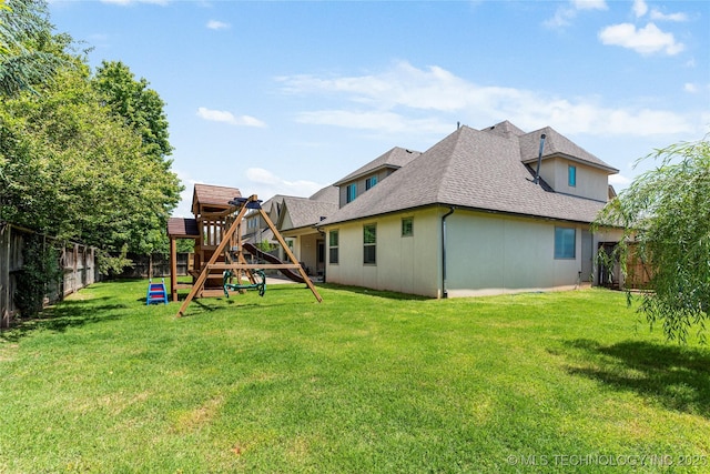 2835 E 104th St, Tulsa, OK 74137 - back of house with a playground and a shingled roof