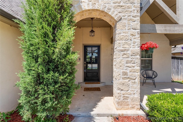 2835 E 104th St, Tulsa, OK 74137 - view of exterior entry with stone siding and stucco siding