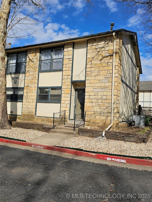 5281 Nowata Rd Unit Q101, Bartlesville, OK 74006 - view of building exterior with central AC