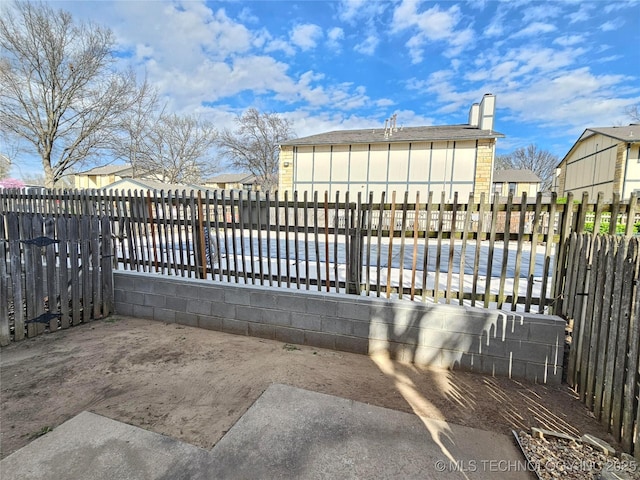 5281 Nowata Rd Unit Q101, Bartlesville, OK 74006 - exterior space featuring a fenced front yard and a residential view
