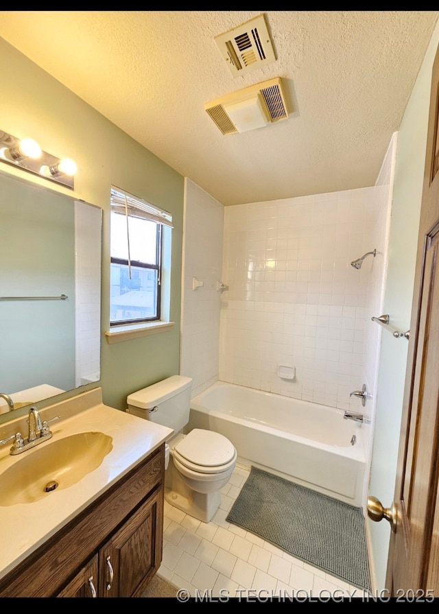 5281 Nowata Rd Unit Q101, Bartlesville, OK 74006 - full bathroom featuring toilet, tile patterned floors, vanity, shower / tub combination, and a textured ceiling