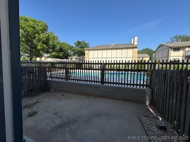 5281 Nowata Rd Unit Q101, Bartlesville, OK 74006 - gate featuring a patio area
