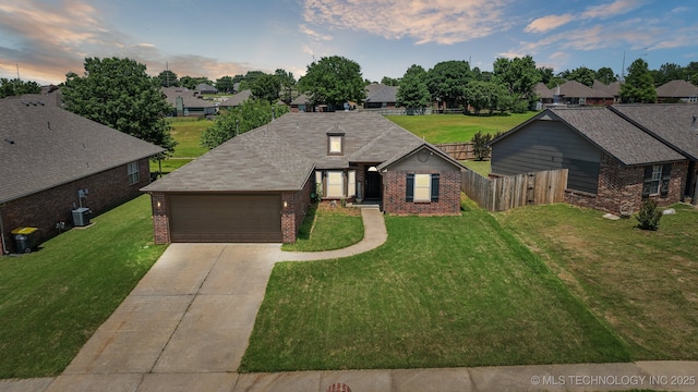 1405 W 118th St S, Jenks, OK 74037 - ranch-style home with brick siding, concrete driveway, an attached garage, and central air condition unit