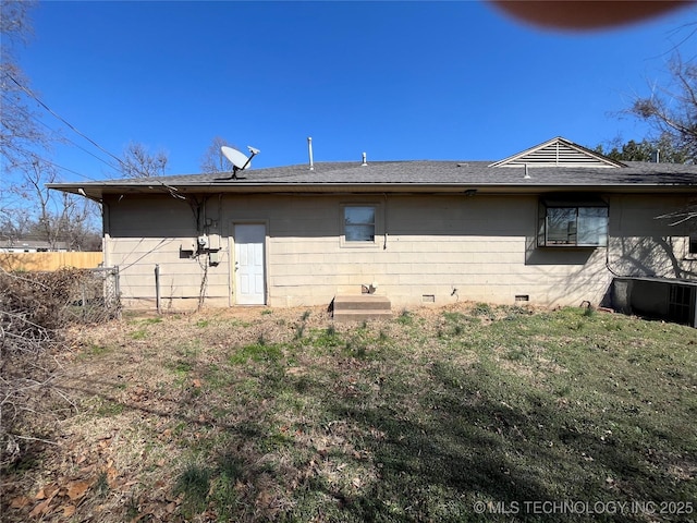 1506 E 46th Pl, Tulsa, OK 74105 - rear view of property featuring fence, a shingled roof, and crawl space