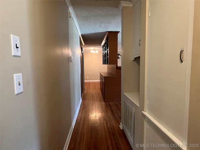 1506 E 46th Pl, Tulsa, OK 74105 - hall featuring dark wood finished floors, baseboards, and a textured ceiling
