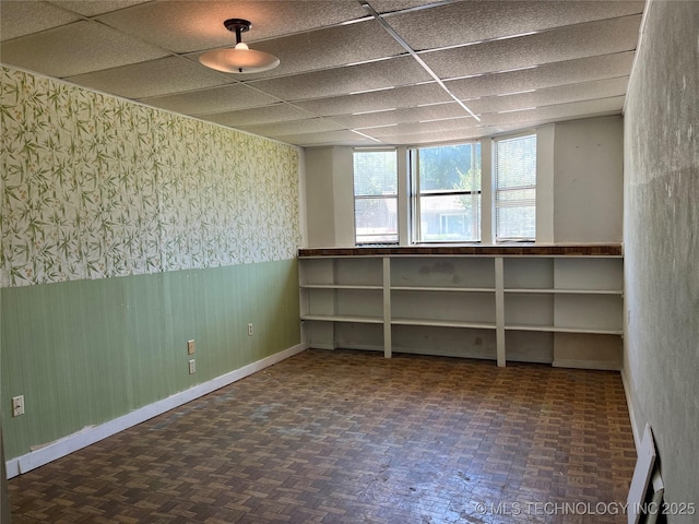 1506 E 46th Pl, Tulsa, OK 74105 - basement with wallpapered walls, wainscoting, and baseboards