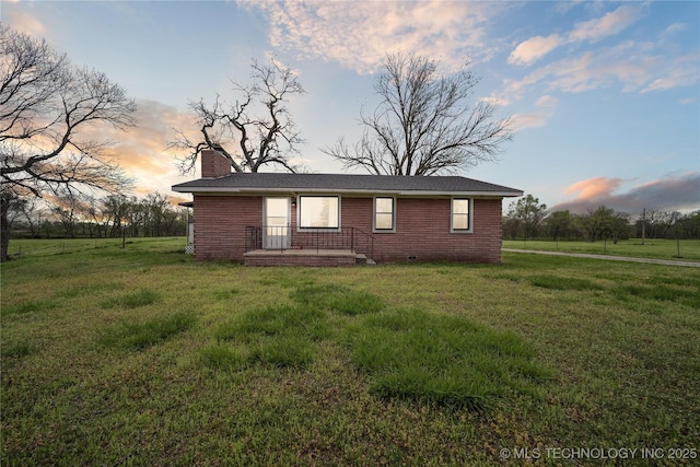 435781 E 130th Rd, Welch, OK 74369 - view of side of property featuring a chimney, a lawn, and brick siding