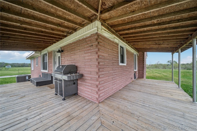 435781 E 130th Rd, Welch, OK 74369 - wooden deck featuring cooling unit, a grill, and a lawn