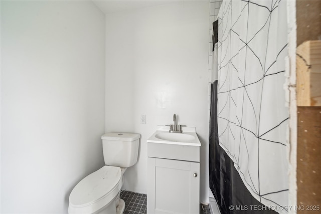 435781 E 130th Rd, Welch, OK 74369 - bathroom with toilet, tile patterned flooring, and vanity