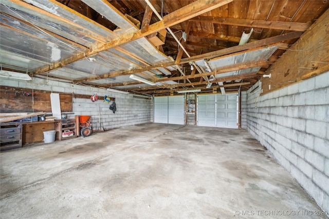 435781 E 130th Rd, Welch, OK 74369 - garage featuring concrete block wall