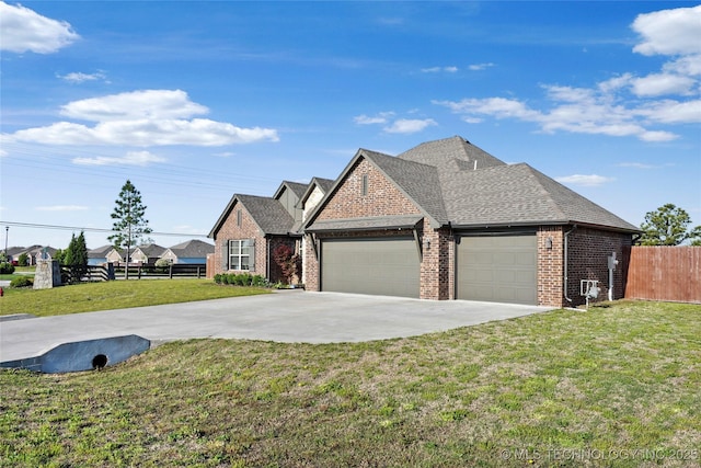 2661 S Catalayah Ln, Claremore, OK 74019 - view of front of house with brick siding, a garage, driveway, and a shingled roof