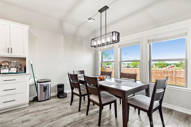 2661 S Catalayah Ln, Claremore, OK 74019 - dining space with baseboards, light wood-style floors, and a chandelier