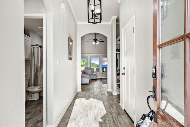 2661 S Catalayah Ln, Claremore, OK 74019 - hall featuring wood finished floors, baseboards, and crown molding