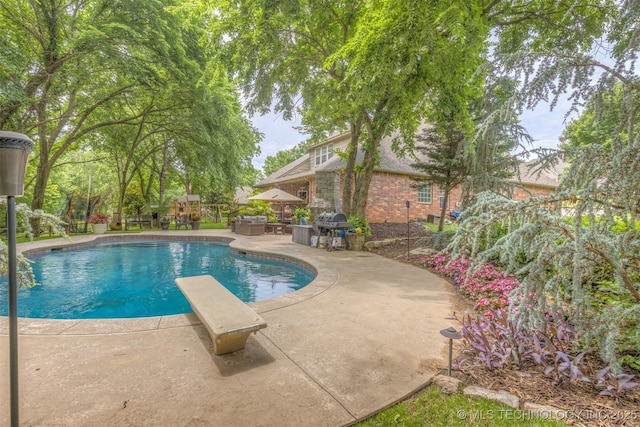 7333 S 286th E Ave, Broken Arrow, OK 74014 - view of pool featuring a patio area, grilling area, and a diving board