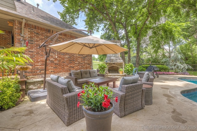 7333 S 286th E Ave, Broken Arrow, OK 74014 - view of patio / terrace featuring an outdoor living space with a fireplace, an outdoor pool, and area for grilling