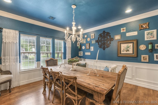 7333 S 286th E Ave, Broken Arrow, OK 74014 - dining space featuring a chandelier, ornamental molding, wood finished floors, a wainscoted wall, and recessed lighting