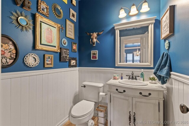 7333 S 286th E Ave, Broken Arrow, OK 74014 - bathroom with wainscoting, toilet, and vanity
