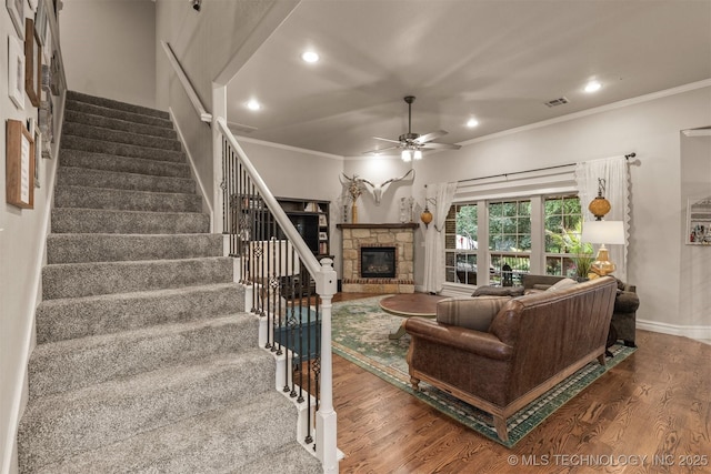 7333 S 286th E Ave, Broken Arrow, OK 74014 - living area with a stone fireplace, wood finished floors, ceiling fan, crown molding, and recessed lighting