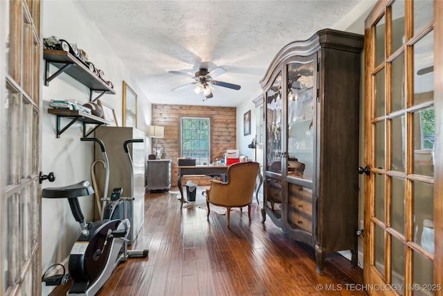 office space with ceiling fan, french doors, dark wood-style flooring, and a textured ceiling