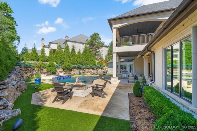6830 E 109th St, Tulsa, OK 74133 - view of patio / terrace with a balcony, a fire pit, and an outdoor pool