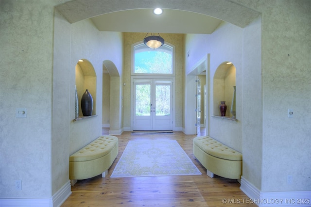 14832 S 53rd E Ave, Bixby, OK 74008 - entryway featuring wood finished floors, arched walkways, and baseboards