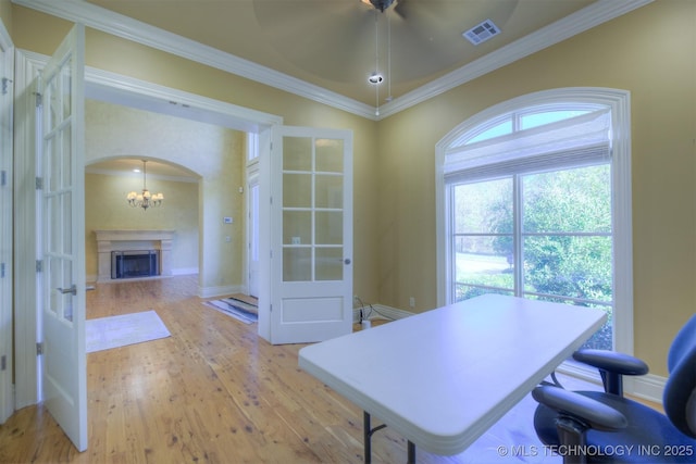 14832 S 53rd E Ave, Bixby, OK 74008 - office area with light wood-style floors, arched walkways, ornamental molding, a fireplace, and a chandelier