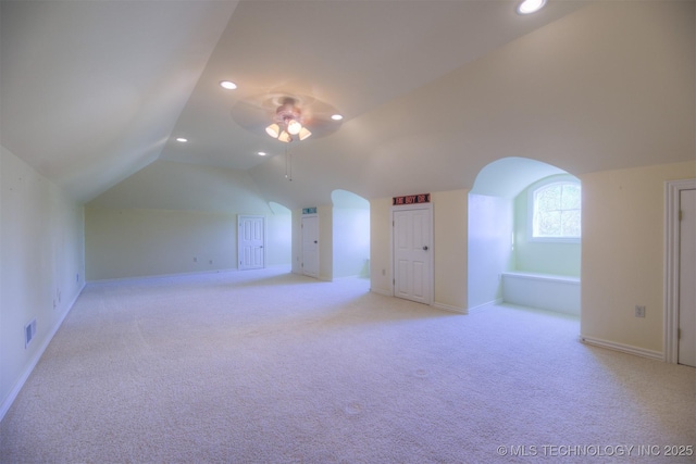14832 S 53rd E Ave, Bixby, OK 74008 - additional living space featuring lofted ceiling, arched walkways, recessed lighting, light carpet, and baseboards