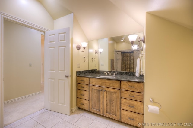 14832 S 53rd E Ave, Bixby, OK 74008 - bathroom with vaulted ceiling, tile patterned flooring, vanity, and baseboards