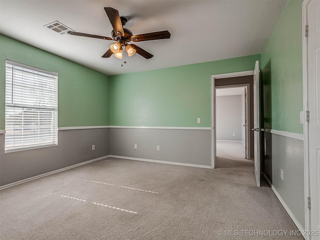 15412 E 78th St N, Owasso, OK 74055 - spare room featuring a ceiling fan, carpet, and baseboards