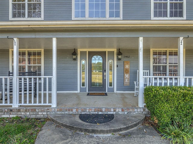 15412 E 78th St N, Owasso, OK 74055 - doorway to property featuring covered porch