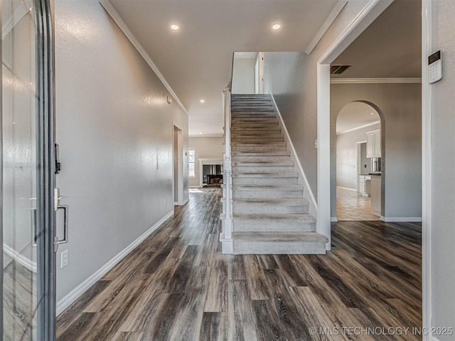 15412 E 78th St N, Owasso, OK 74055 - stairs featuring ornamental molding, baseboards, wood finished floors, recessed lighting, and a fireplace