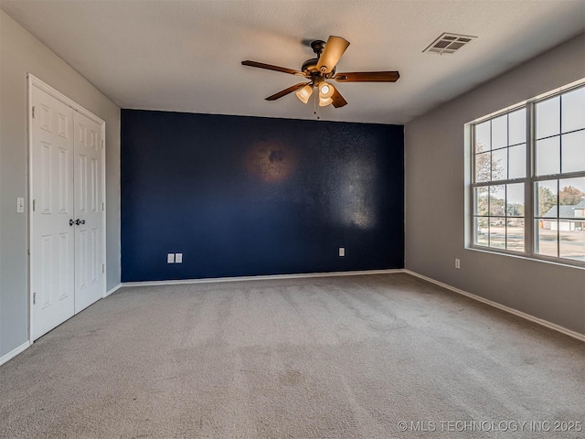 15412 E 78th St N, Owasso, OK 74055 - carpeted empty room featuring a ceiling fan and baseboards
